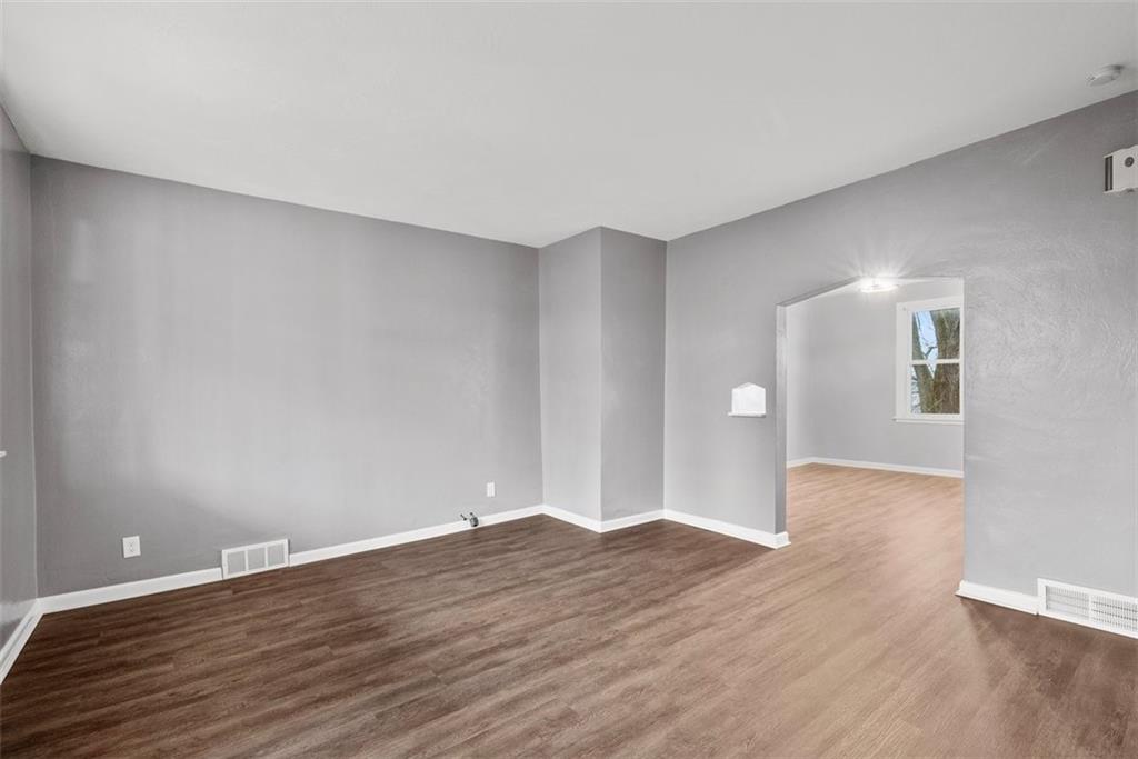 76 Montclair Avenue Pittsburgh, PA 15229 - Photo 5 of 34 a view of an empty room with wooden floor and a window