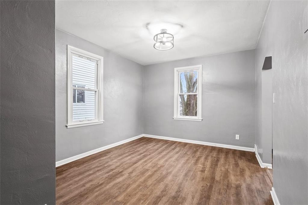 76 Montclair Avenue Pittsburgh, PA 15229 - Photo 7 of 34 a view of empty room with wooden floor and fan