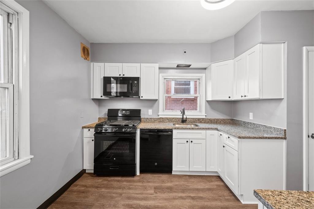76 Montclair Avenue Pittsburgh, PA 15229 - Photo 10 of 34 a kitchen with stainless steel appliances granite countertop a stove and a sink
