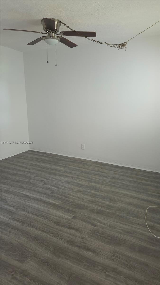 502-504 Phippen Waiters Road, Unit 3 Dania Beach, FL 33004 - Photo 13 of 22 a view of a room with racks on the wall