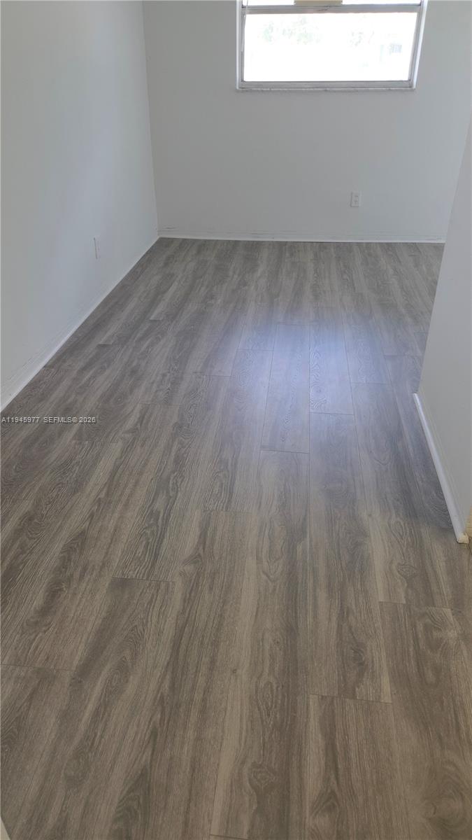 502-504 Phippen Waiters Road, Unit 3 Dania Beach, FL 33004 - Photo 20 of 22 a view of a room with wooden floor