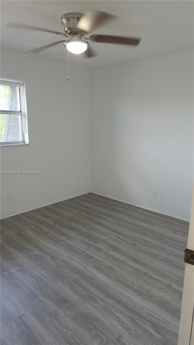 502-504 Phippen Waiters Road, Unit 3 Dania Beach, FL 33004 - Photo 7 of 22 wooden floor in an empty room