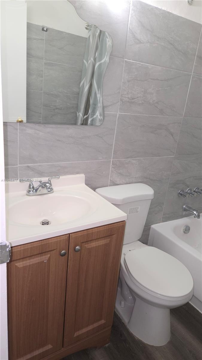 502-504 Phippen Waiters Road, Unit 3 Dania Beach, FL 33004 - Photo 9 of 22 a bathroom with a sink a toilet and shower
