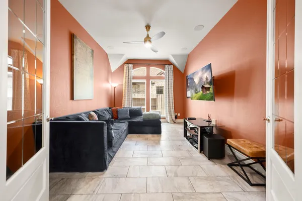 a lobby with furniture and large windows