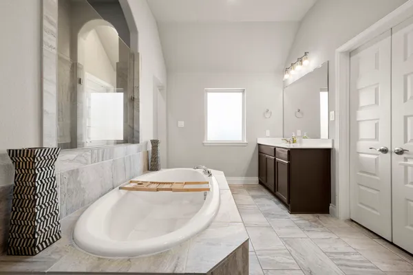 a en suite bathroom with a sink and a mirror