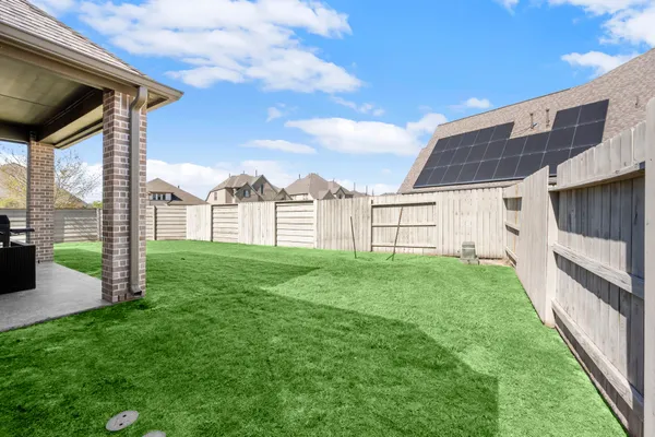 a view of a backyard with garden