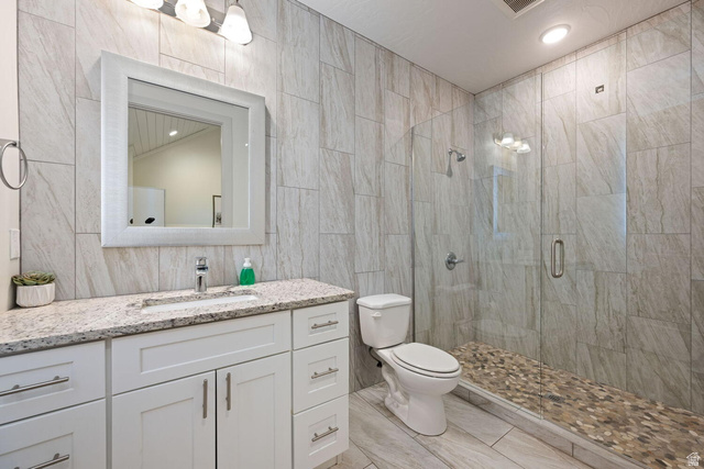 4281 Canterbury Road Hurricane, UT 84737 - Photo 20 of 24 Bathroom featuring a full-width vanity with white cabinetry, a granite-finish countertop, and a rectangular undermount sink