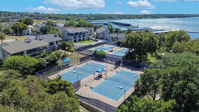 an aerial view of a house with a lake view