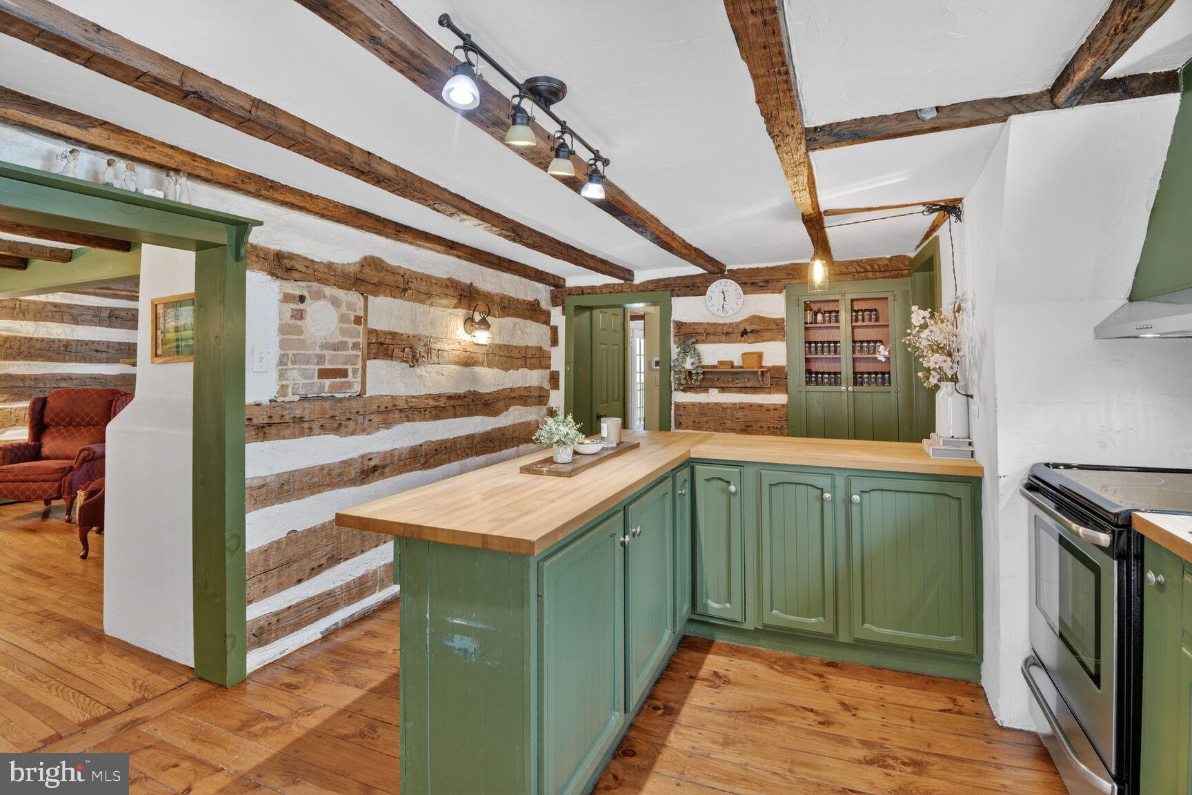 2338 Jim Kohler Road Eldersburg, MD 21784 - Photo 16 of 63 a kitchen with a sink and a refrigerator