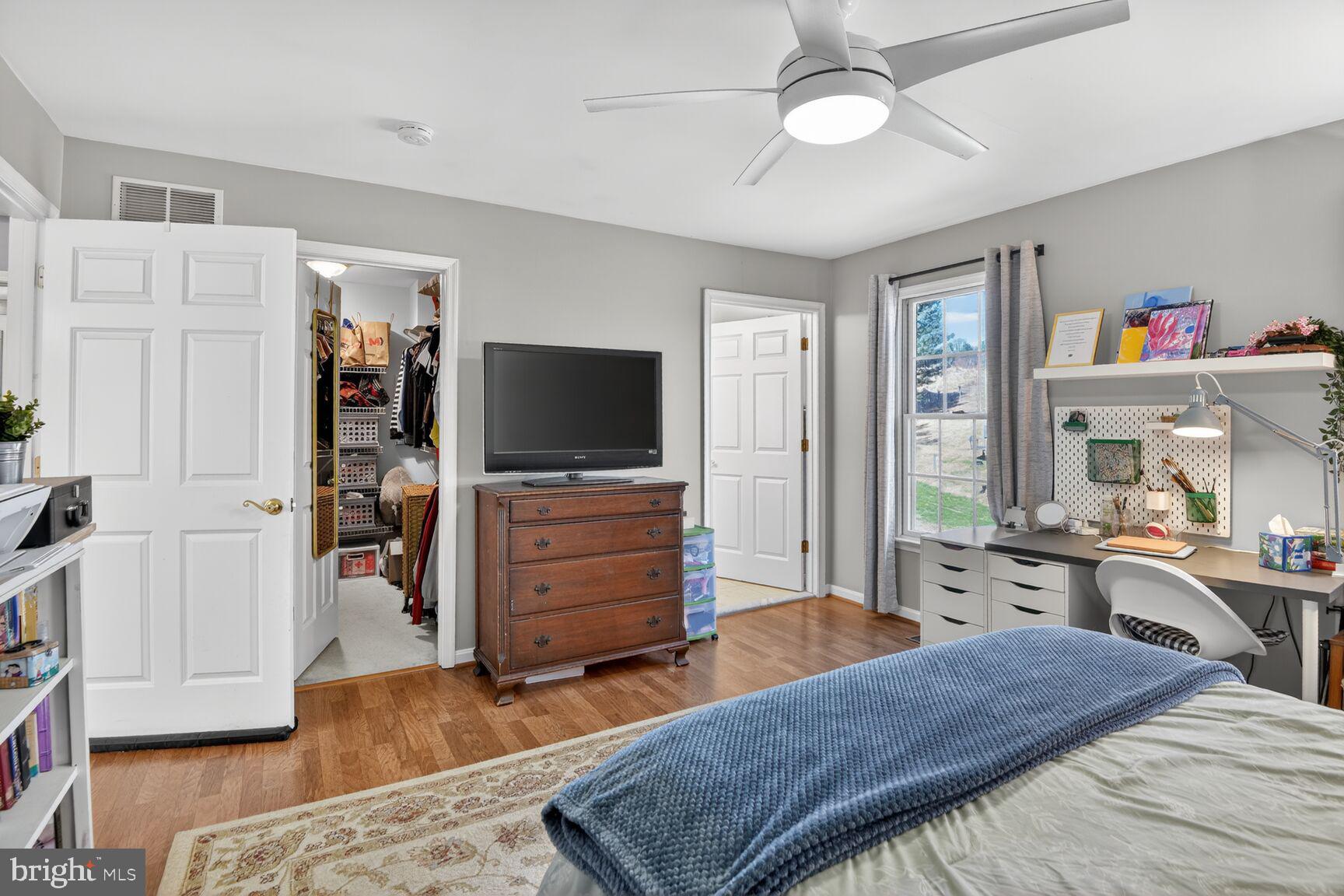 2338 Jim Kohler Road Eldersburg, MD 21784 - Photo 37 of 63 a bedroom with furniture and a flat screen tv