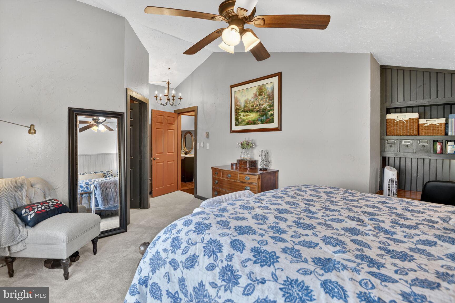 2338 Jim Kohler Road Eldersburg, MD 21784 - Photo 43 of 63 a bedroom with a bed and a chandelier