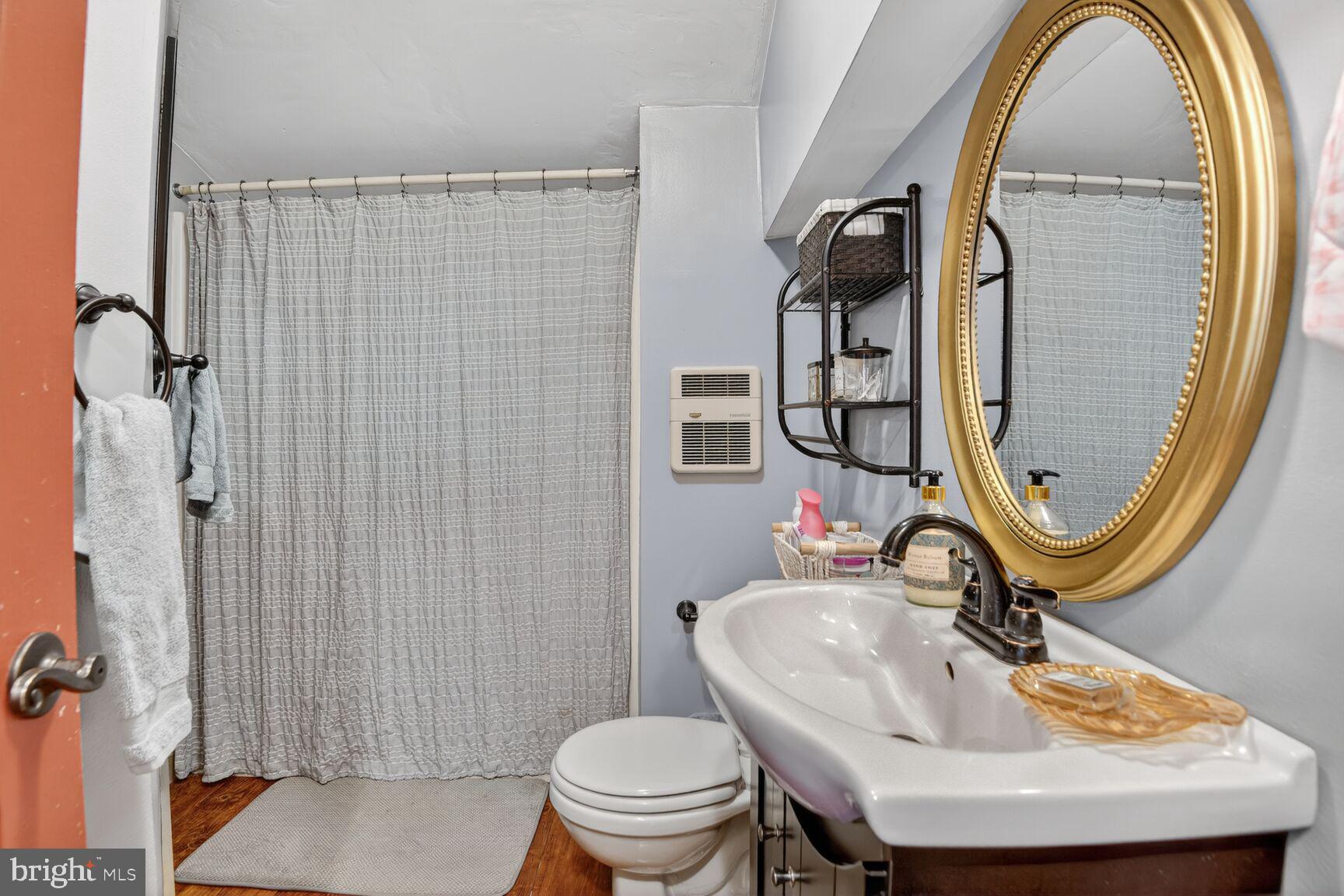 2338 Jim Kohler Road Eldersburg, MD 21784 - Photo 48 of 63 a bathroom with a sink and a mirror