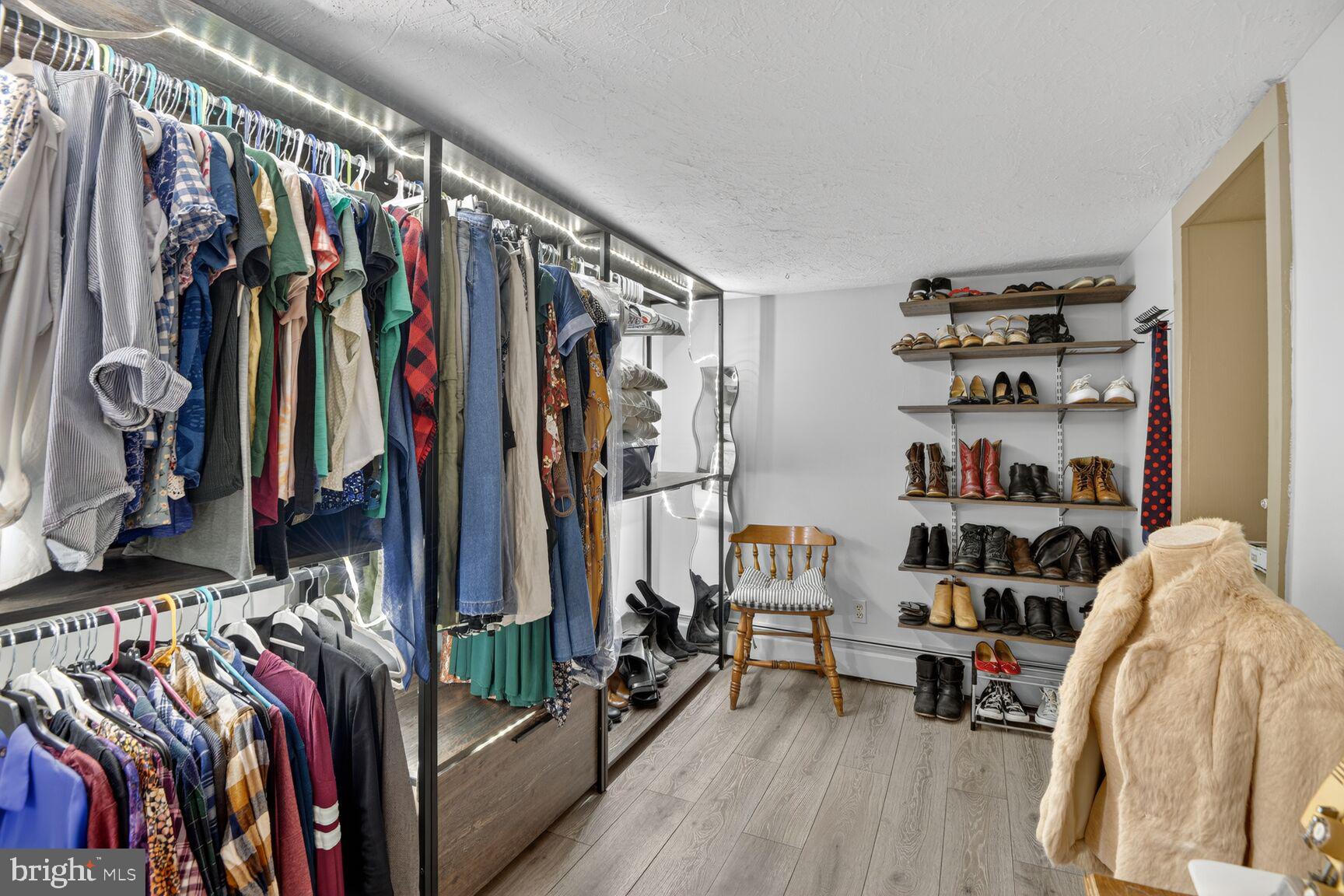 2338 Jim Kohler Road Eldersburg, MD 21784 - Photo 50 of 63 a view of walk in closet with clothes and shoes