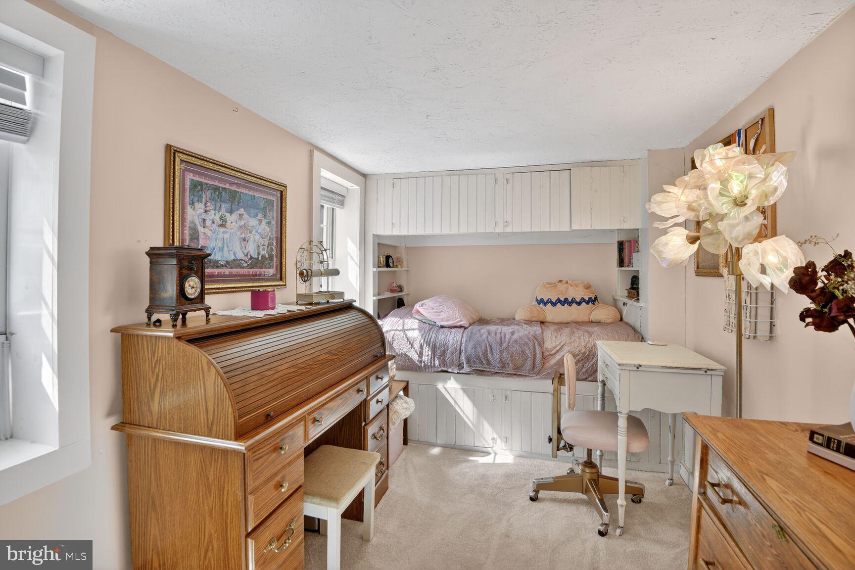 2338 Jim Kohler Road Eldersburg, MD 21784 - Photo 51 of 63 a bedroom with a bed and a table in it