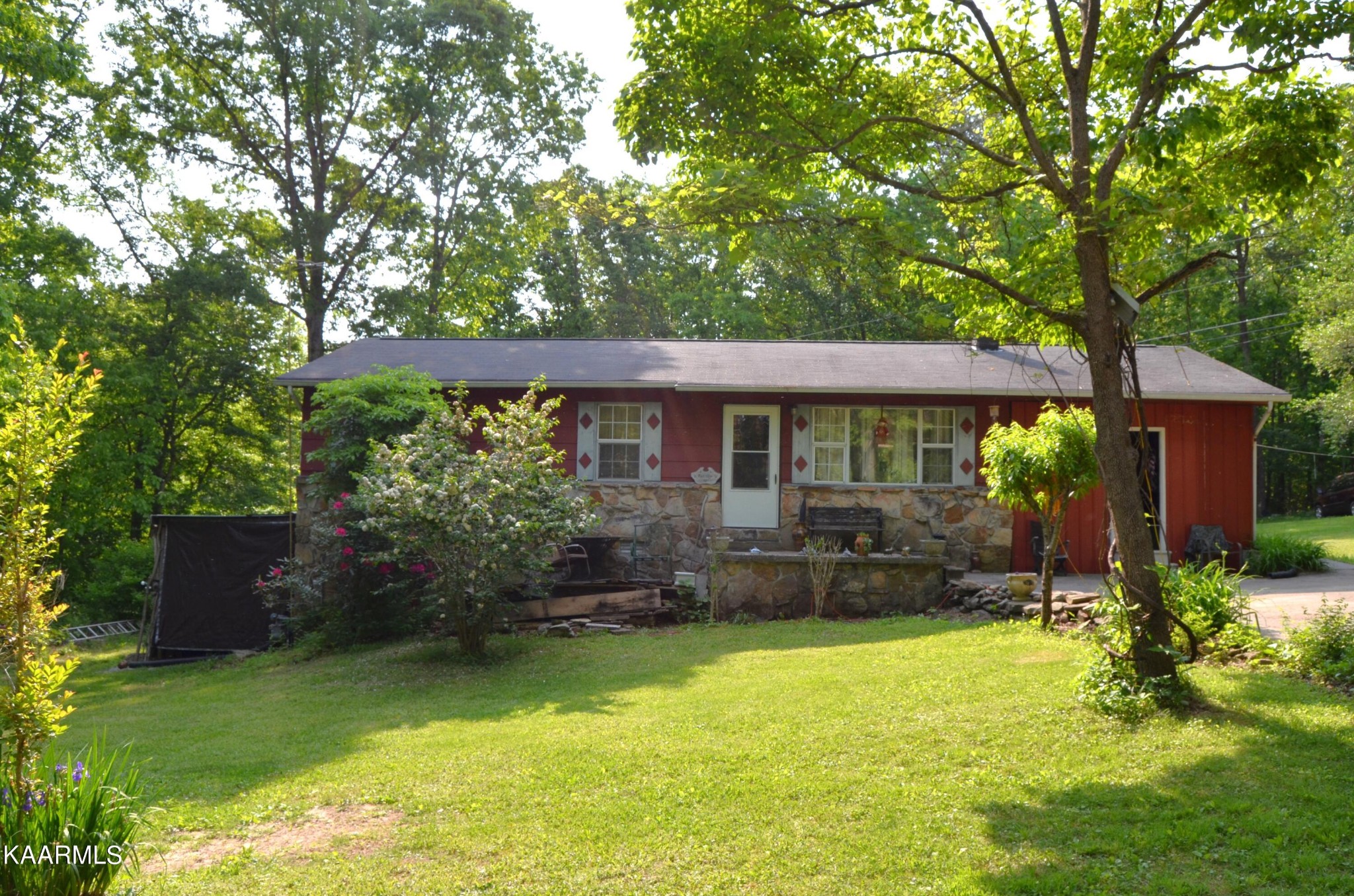 484 Kerrigan Road Crossville, TN 38555 - Photo 1 of 23 a front view of a house with a yard