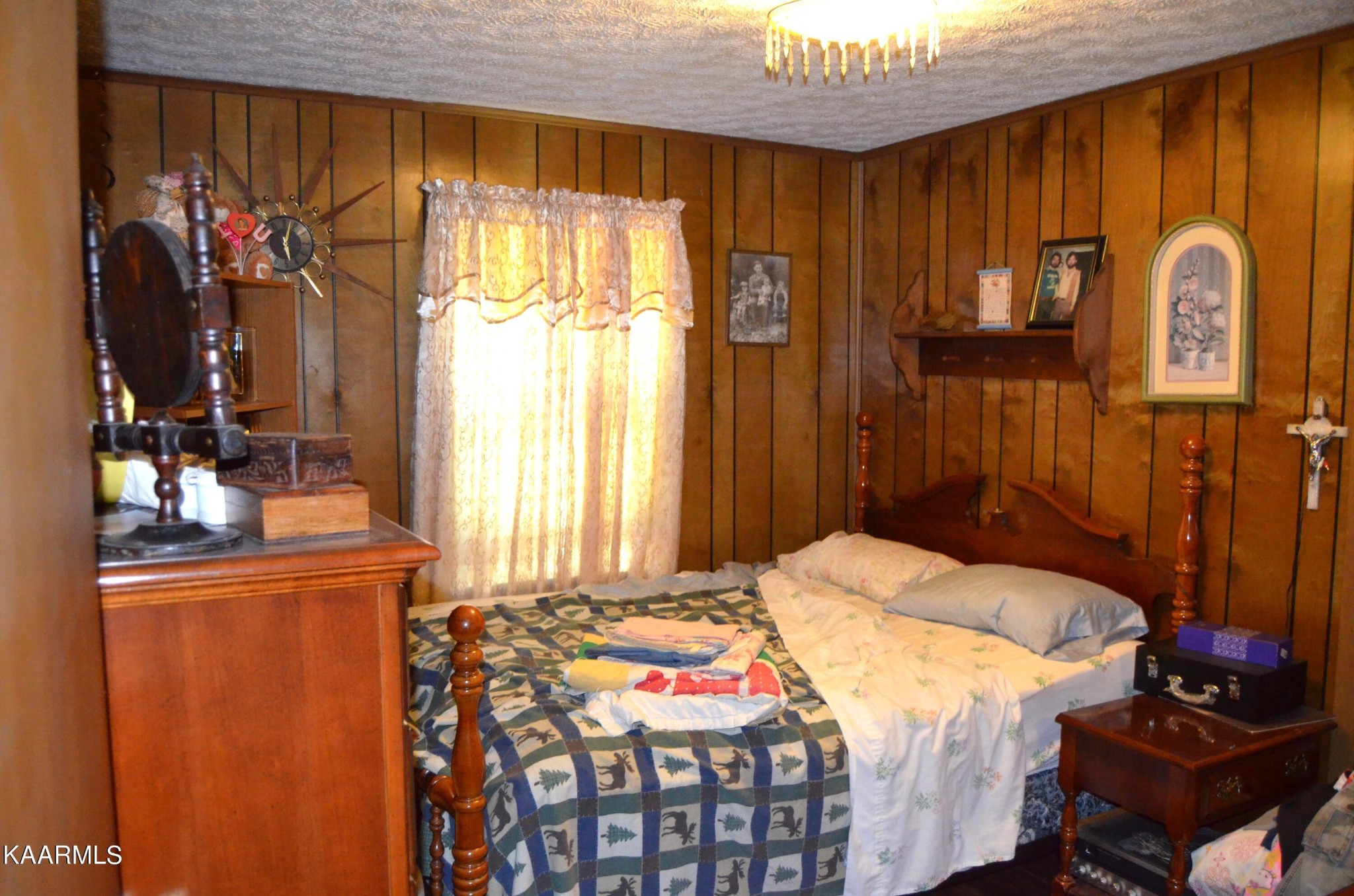 484 Kerrigan Road Crossville, TN 38555 - Photo 14 of 23 a bedroom with a bed and dresser with mirror