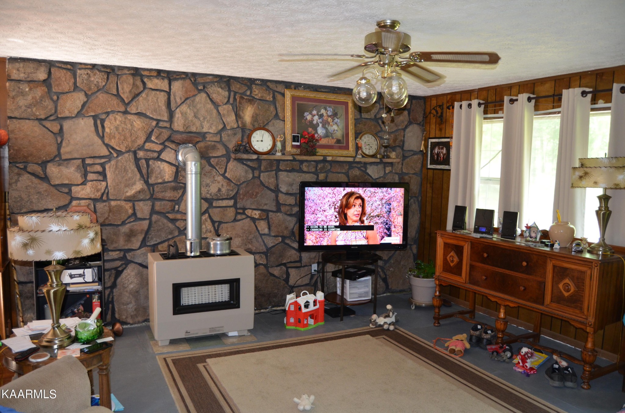 484 Kerrigan Road Crossville, TN 38555 - Photo 3 of 23 a living room with fireplace furniture and a flat screen tv