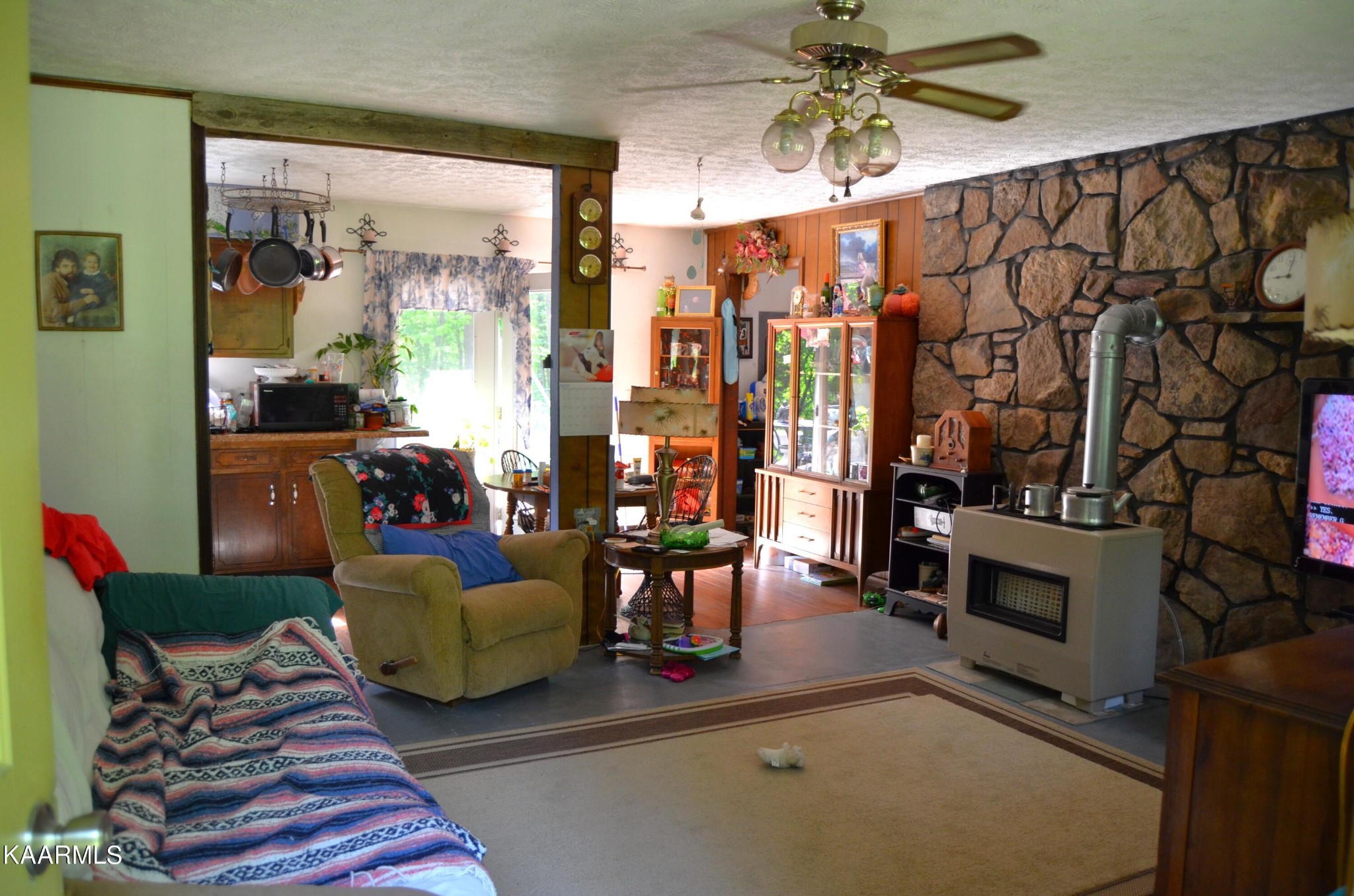 484 Kerrigan Road Crossville, TN 38555 - Photo 4 of 23 a living room with furniture and a fireplace