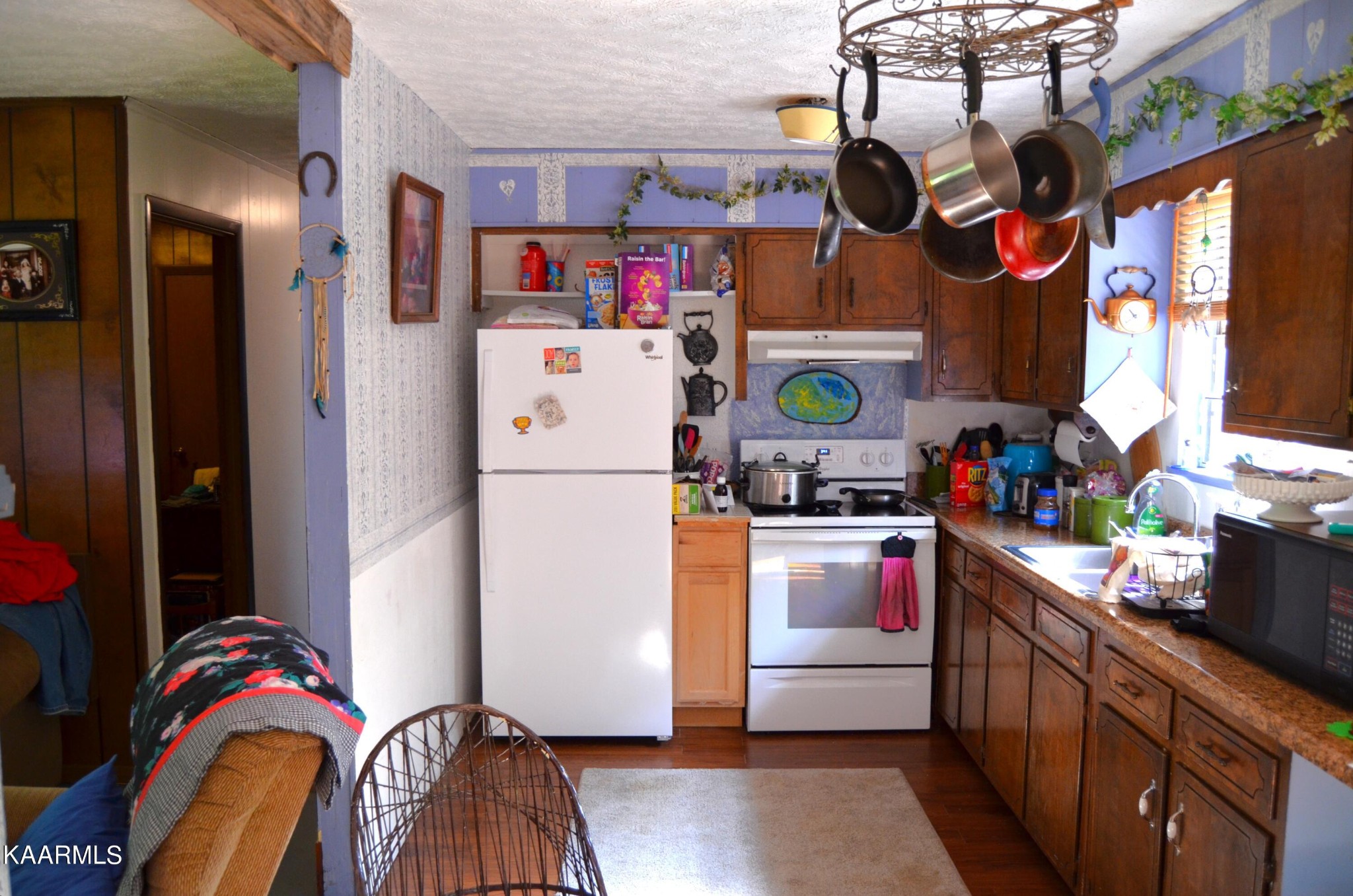 484 Kerrigan Road Crossville, TN 38555 - Photo 7 of 23 a kitchen with stainless steel appliances granite countertop a refrigerator and a stove