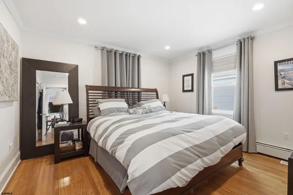a bedroom with a bed and a table
