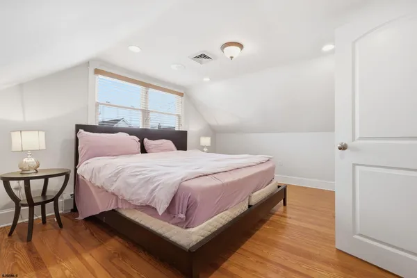 a bathroom with a sink a mirror and a shower