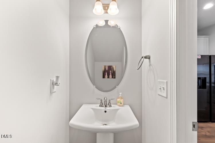 117 Boomer Street Benson, NC 27504 - Photo 13 of 31 a bathroom with a sink and a mirror