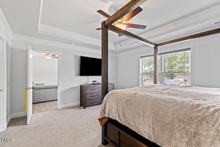 117 Boomer Street Benson, NC 27504 - Photo 18 of 31 a living room with a bed a flat screen tv and a large window