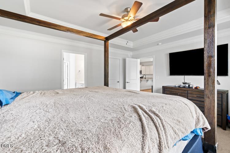 117 Boomer Street Benson, NC 27504 - Photo 19 of 31 a bedroom with a bed and a flat screen tv