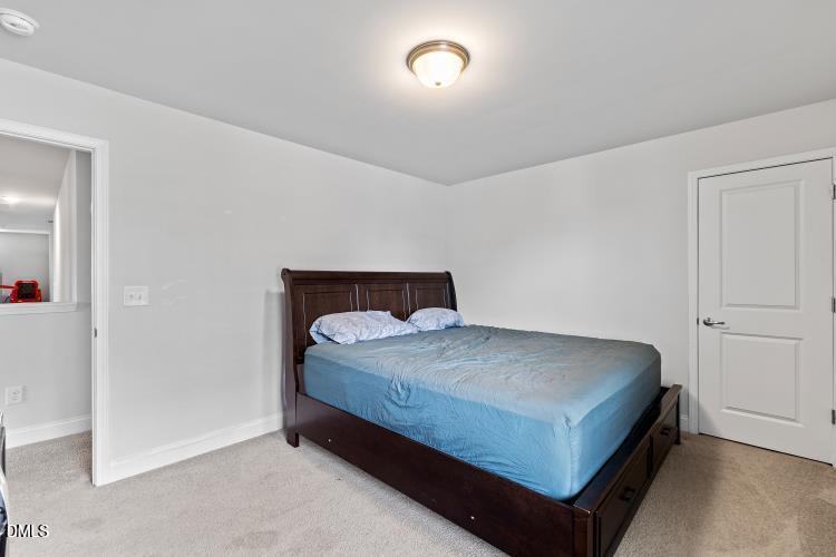 117 Boomer Street Benson, NC 27504 - Photo 24 of 31 a bedroom with a bed and a window