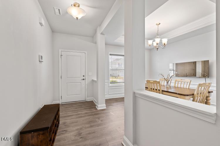 117 Boomer Street Benson, NC 27504 - Photo 6 of 31 a living room with a bed furniture and a flat screen tv