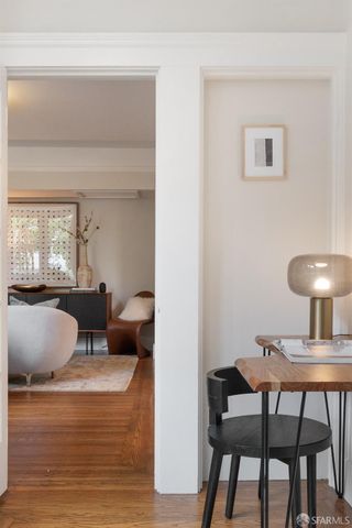 a living room with furniture and a lamp