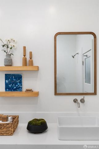 a bathroom with a tub and a sink