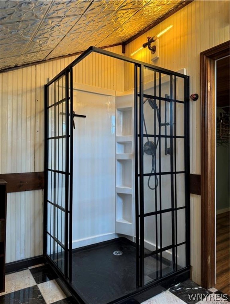 664 Back Street Pembroke, NY 14036 - Photo 26 of 44 Primary suite bathroom w black frame glass stand-u