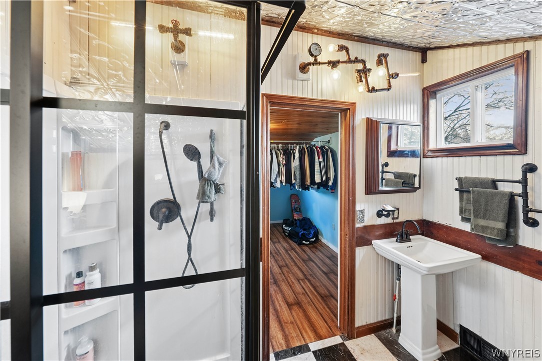 664 Back Street Pembroke, NY 14036 - Photo 27 of 44 Primary suite bathroom w black frame glass stand-u
