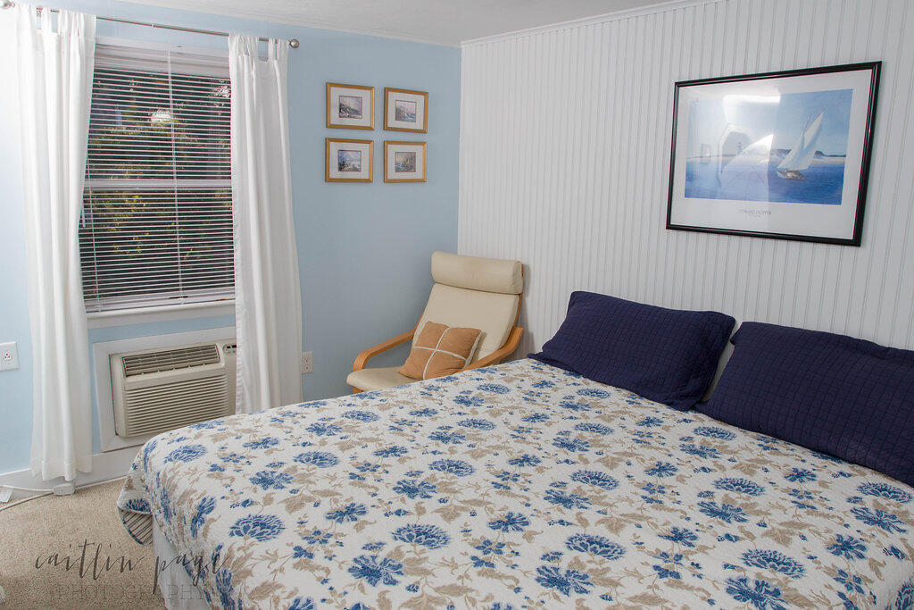 154 Old Wharf Road, Unit 19 Dennis Port, MA 02639 - Photo 7 of 15 a bedroom with a large bed and a window