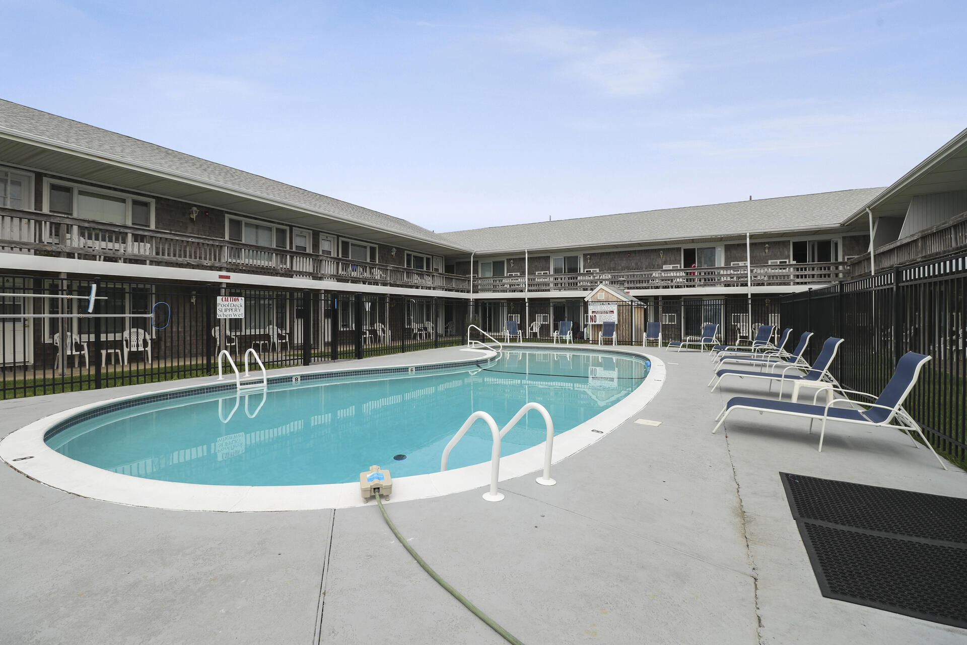 154 Old Wharf Road, Unit 19 Dennis Port, MA 02639 - Photo 8 of 15 a view of a swimming pool with a patio