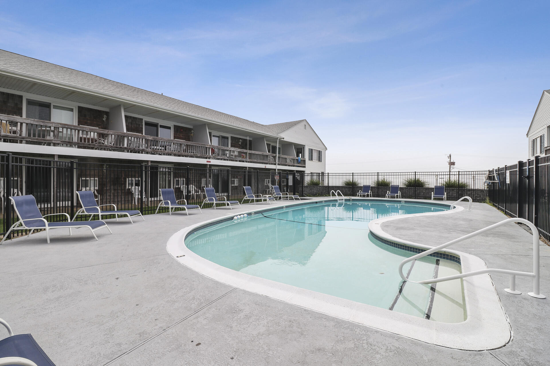 154 Old Wharf Road, Unit 19 Dennis Port, MA 02639 - Photo 9 of 15 a view of a swimming pool with outdoor seating