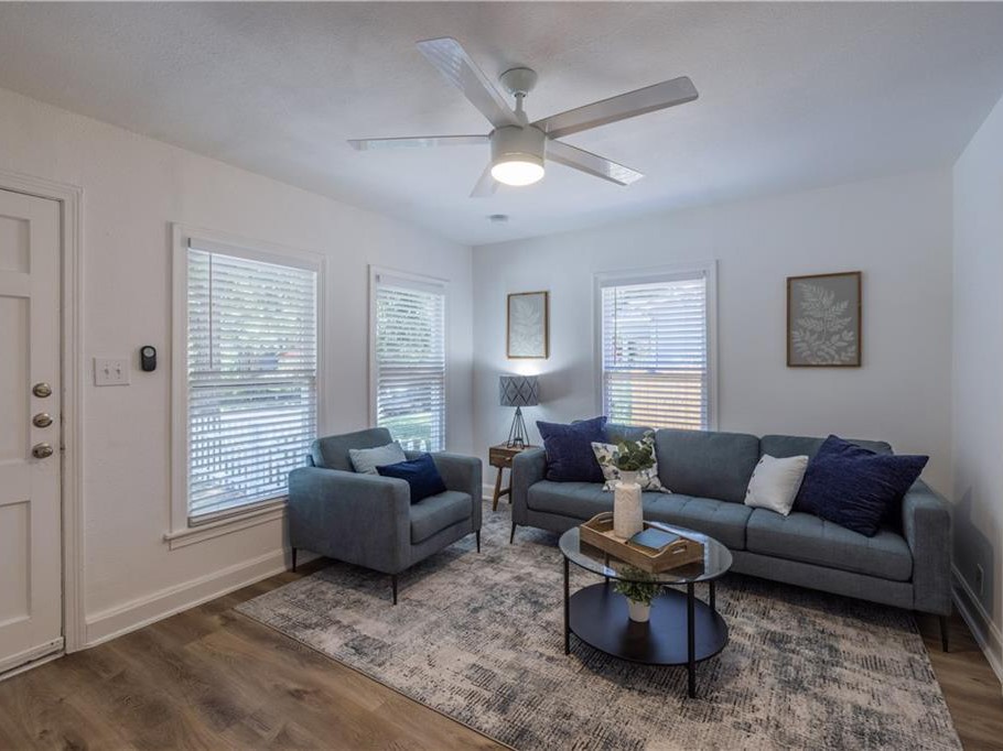 906 Capitol Court, Unit B Austin, TX 78751 - Photo 3 of 12 a living room with furniture and a large window