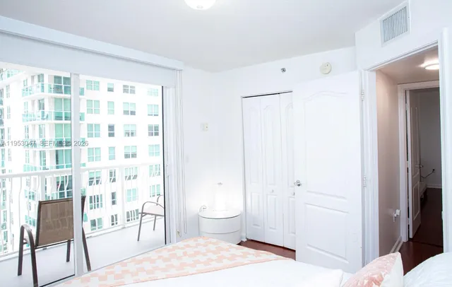 a bedroom with a bed and furniture