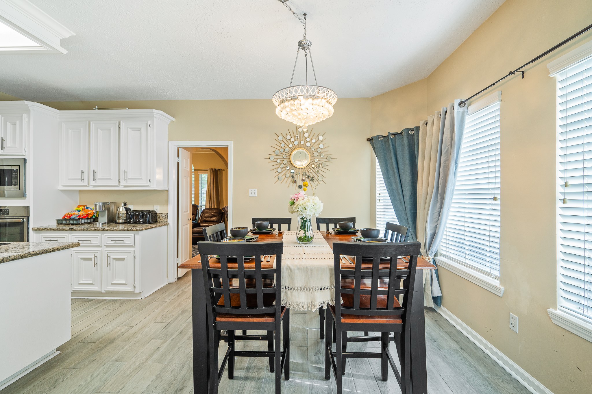 8111 Morningbrook Court Spring, TX 77379 - Photo 15 of 46 a view of a dining room with furniture window and wooden floor