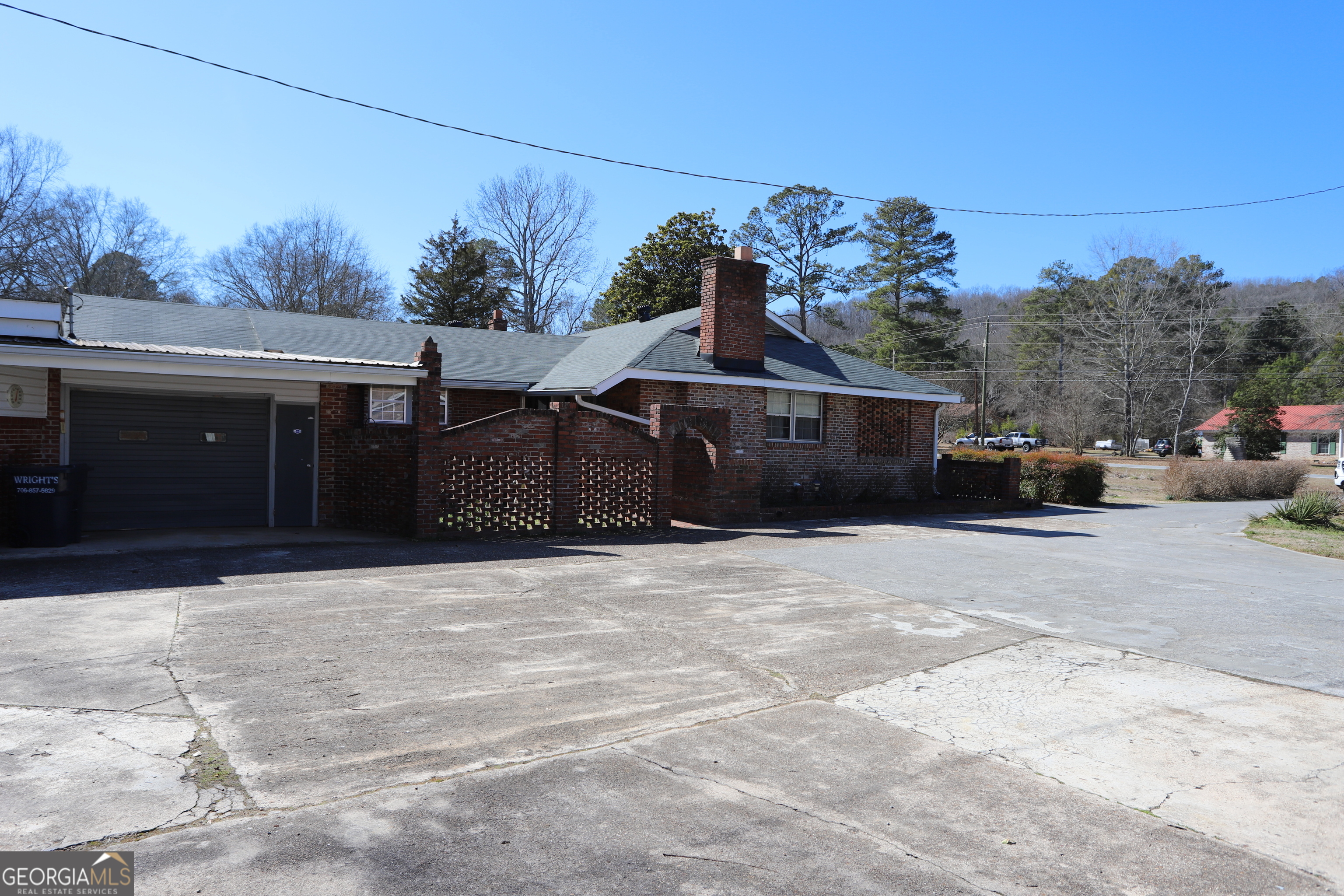 6797 Highway 114 Lyerly, GA 30730 - Photo 13 of 56 a front view of a house with a yard