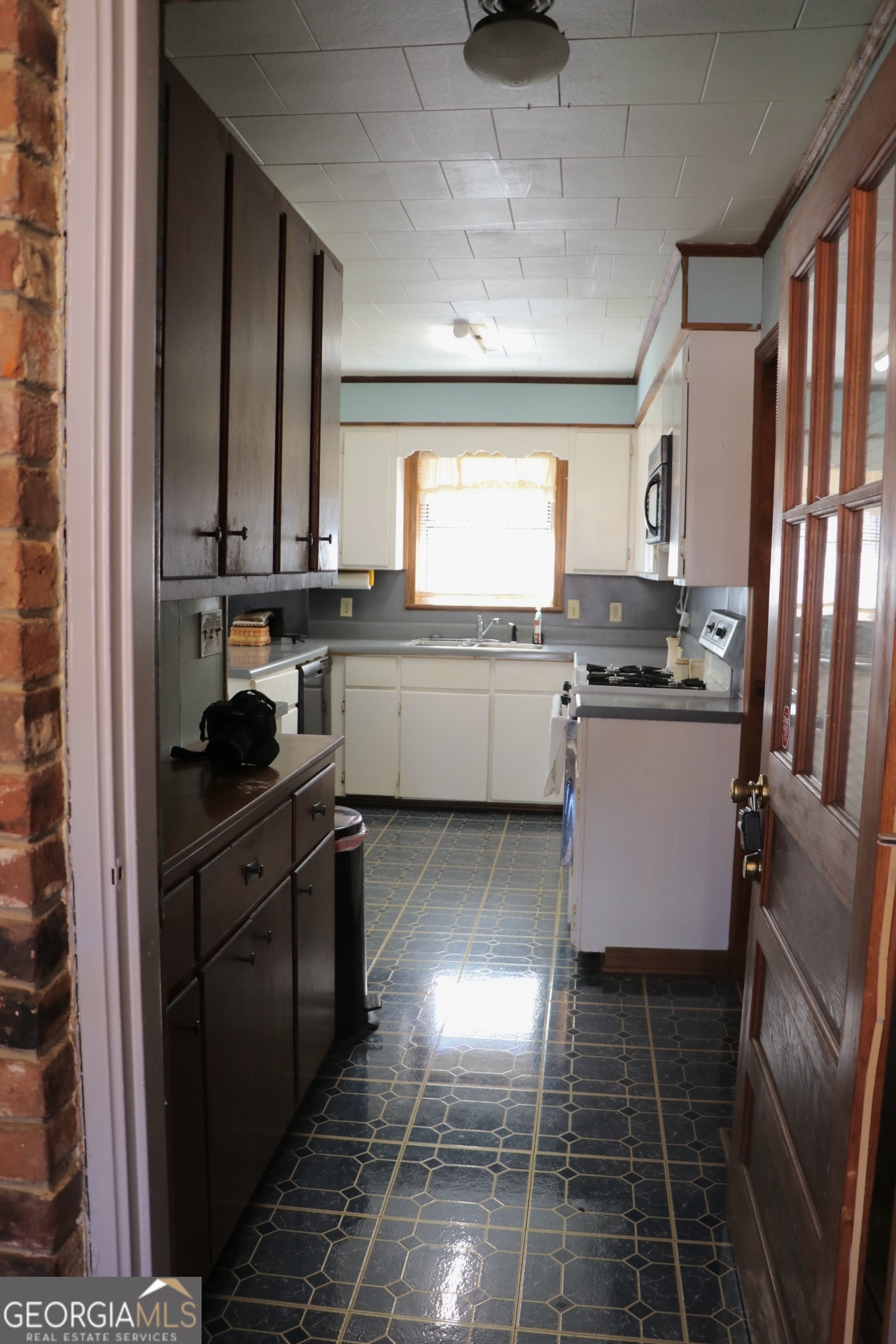 6797 Highway 114 Lyerly, GA 30730 - Photo 19 of 56 a kitchen with stainless steel appliances granite countertop a sink stove and cabinets