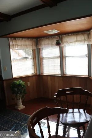 a kitchen with a window and cabinets