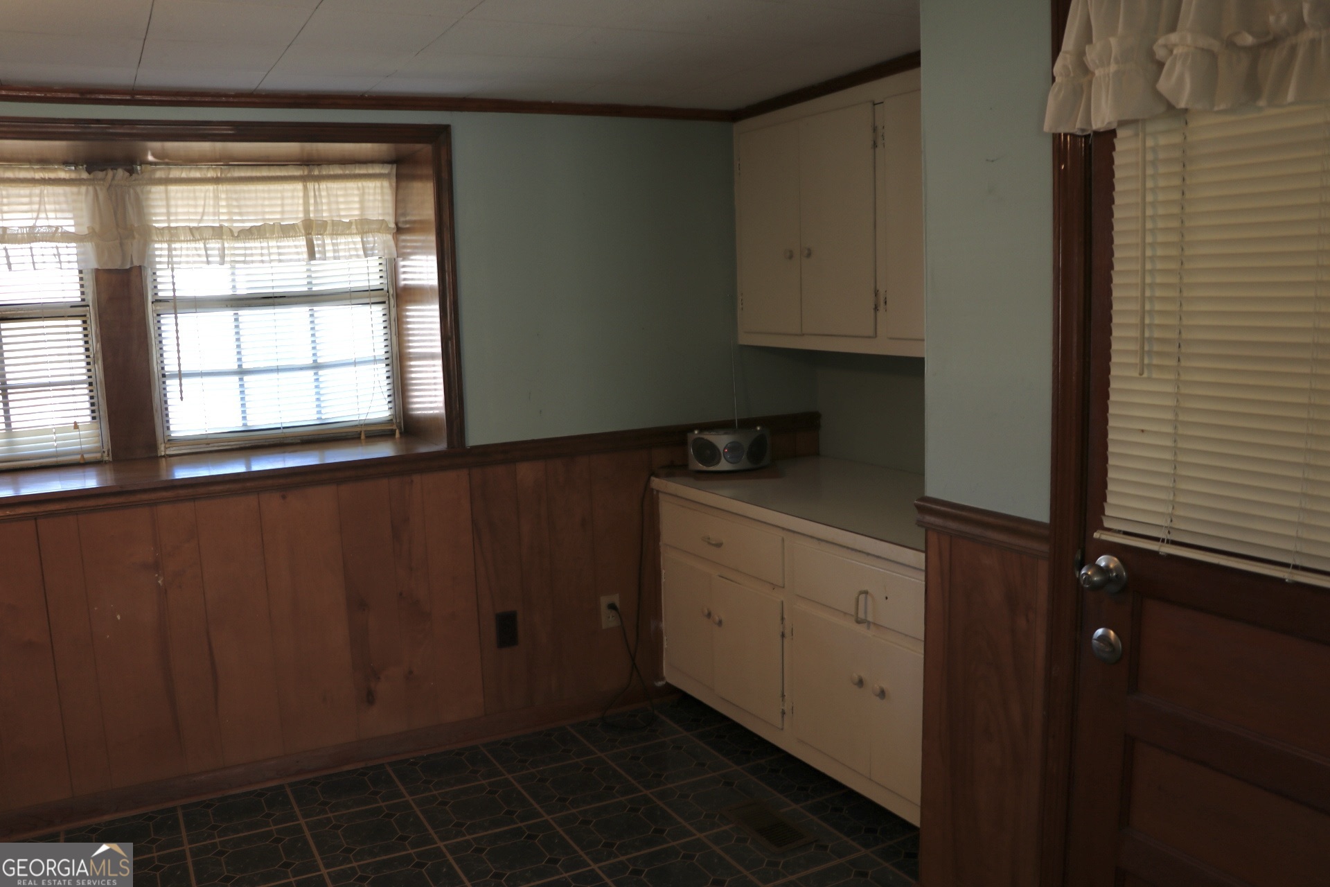 6797 Highway 114 Lyerly, GA 30730 - Photo 23 of 56 a kitchen with a window and cabinets