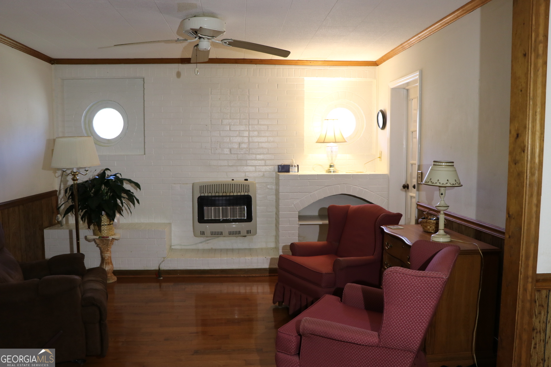 6797 Highway 114 Lyerly, GA 30730 - Photo 29 of 56 a living room with furniture and a fireplace