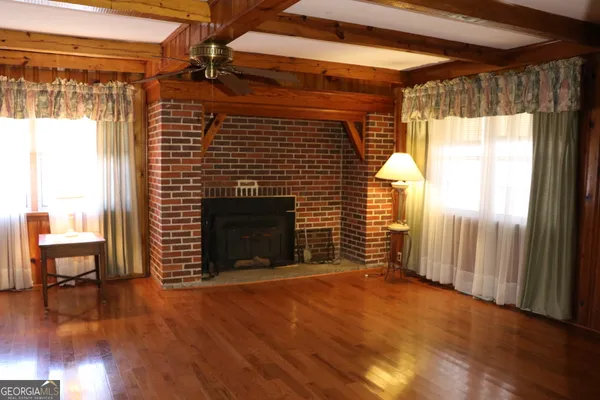 a view of entryway with wooden floor