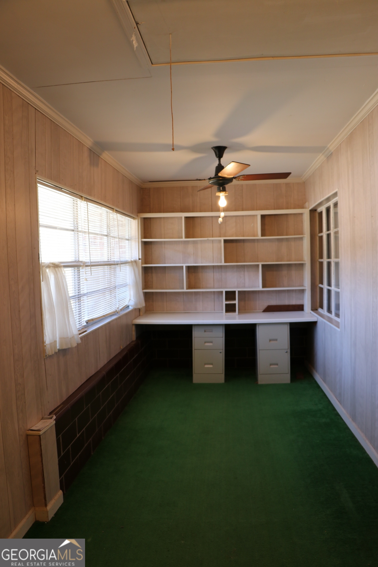 6797 Highway 114 Lyerly, GA 30730 - Photo 36 of 56 a room with kitchen island a stove a sink and a large window