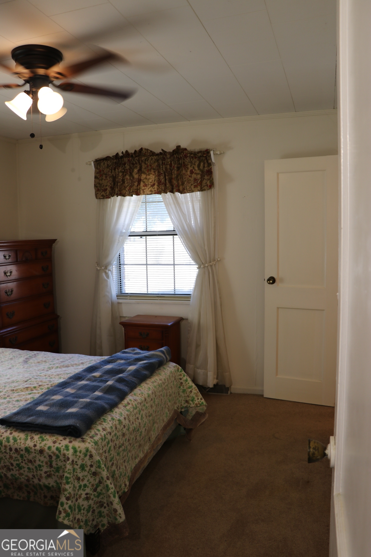6797 Highway 114 Lyerly, GA 30730 - Photo 39 of 56 a bedroom with a bed and a window