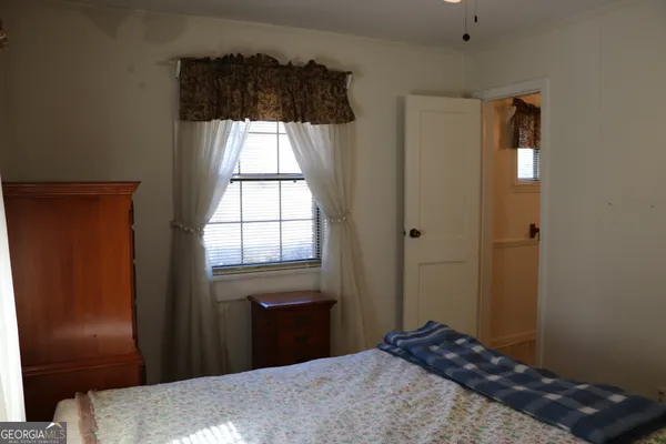 a bathroom with a sink and a window