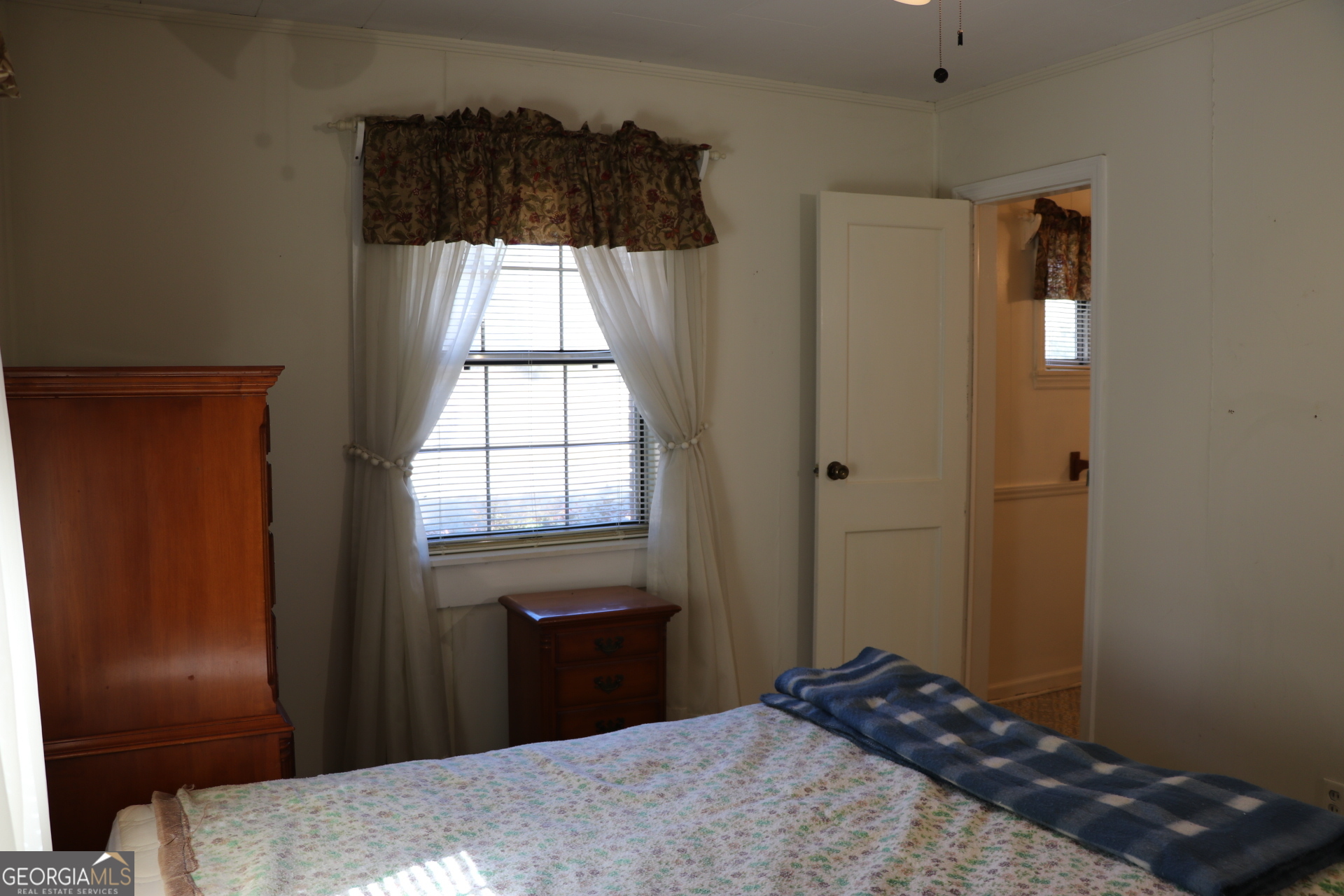 6797 Highway 114 Lyerly, GA 30730 - Photo 40 of 56 a bedroom with a bed and a window